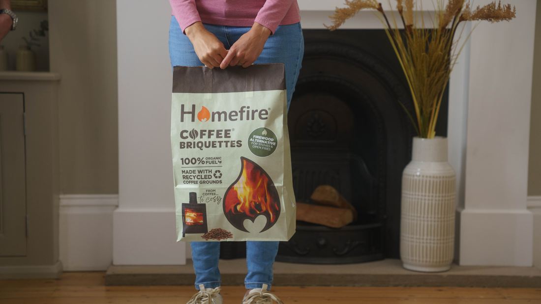 Woman Holding Homefire 7kg 100% Coffee Briquettes bag